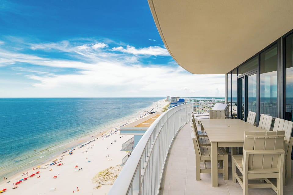 Enjoy meals and sunsets at the spacious outdoor dining table with sweeping views of the coastline