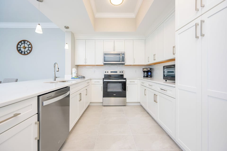 Prepare delicious meals in this bright kitchen, featuring sleek appliances and ample counter space