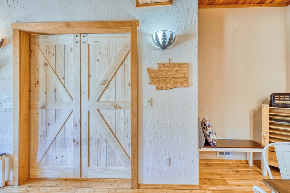 Natural Wood Barn Doors Adding Charm to the Bedroom Space
