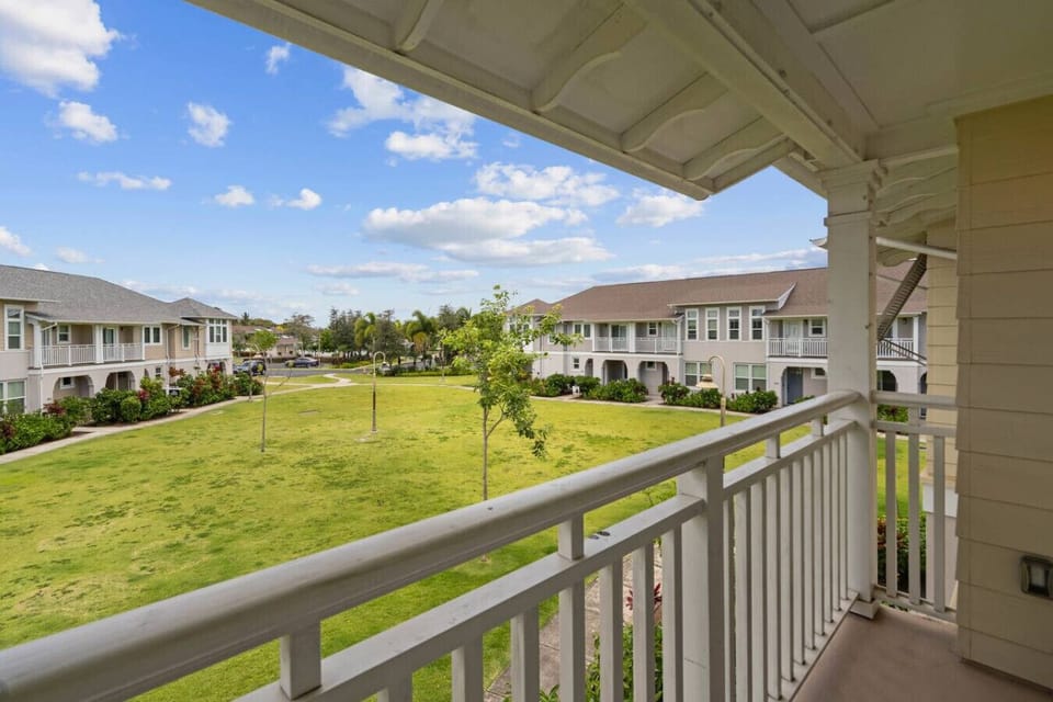 Peaceful neighborhood courtyard with open green space. Perfect for relaxing strolls, outdoor play, or simply enjoying the fresh air.