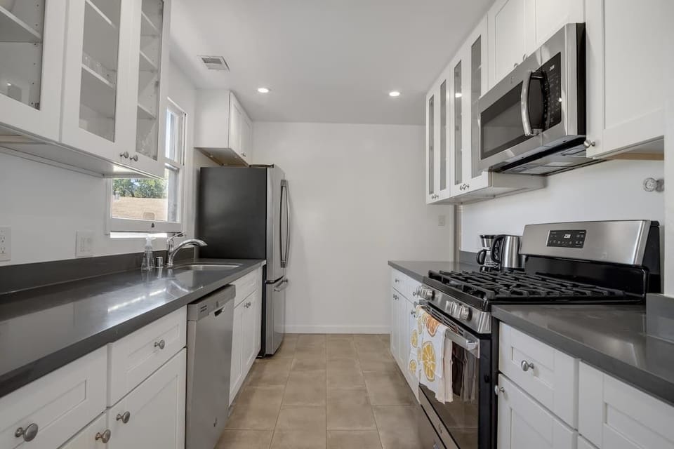 kitchen with gas stove and plenty of counter space and storage.