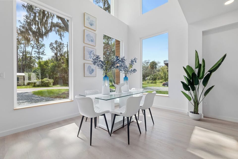 Bright dining space with stunning floor to ceiling windows.