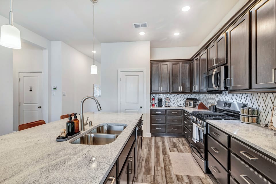Our kitchen includes stainless steel stove, oven, microwave, dishwasher, fridge.