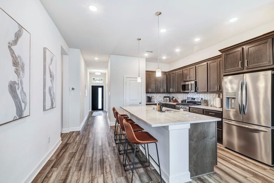 Our kitchen includes stainless steel stove, oven, microwave, dishwasher, fridge.