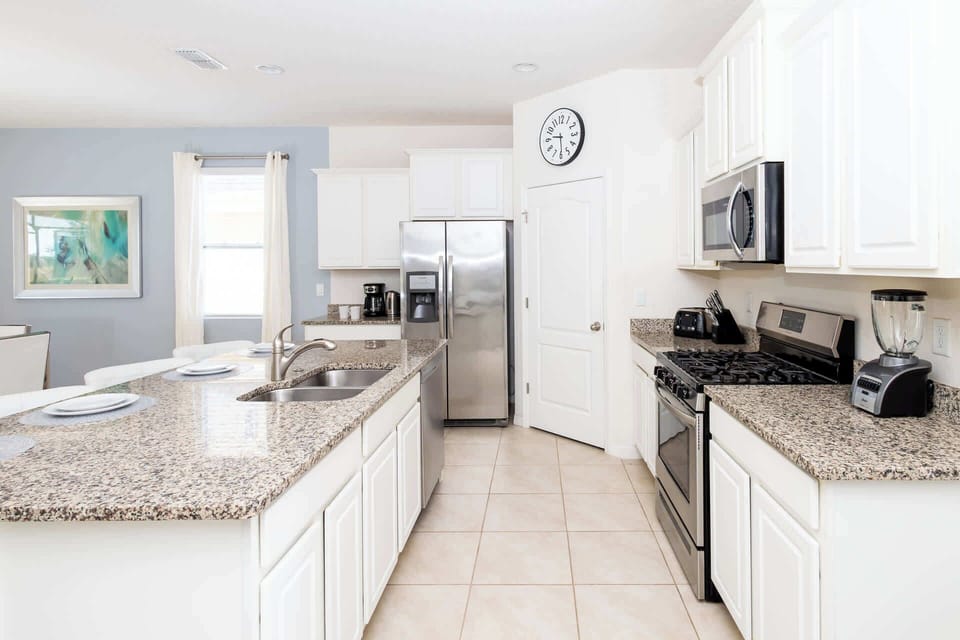 The kitchen offers ample storage space & all the comforts of home