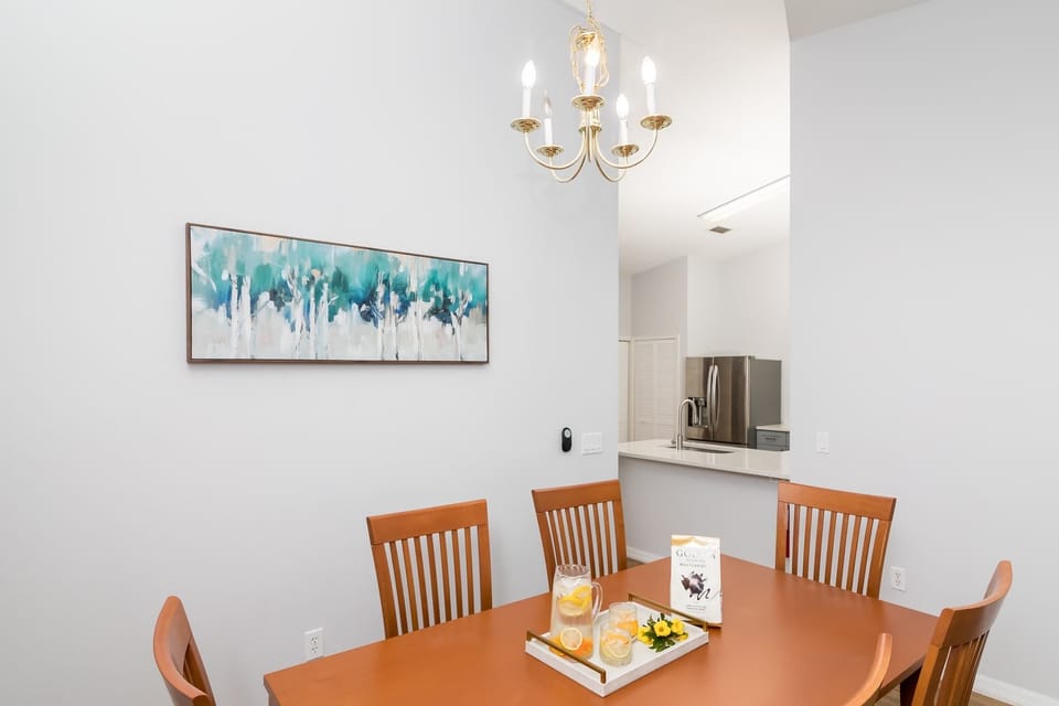 Gather for meals at the dining table with a waterfront view, seating for 6
