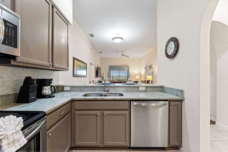 The cozy kitchen offers ample space & all the comforts of home