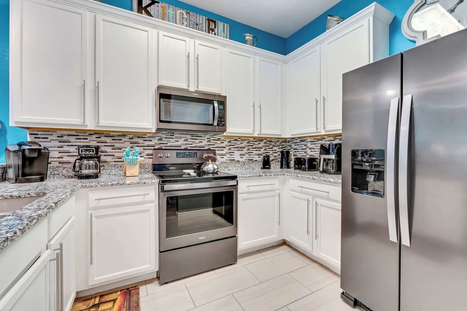 The open, airy kitchen offers ample space & all the comforts of home
