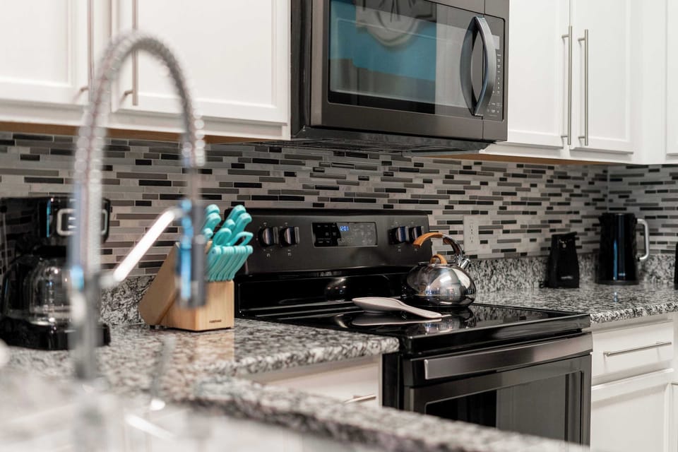 The open, airy kitchen offers ample space & all the comforts of home