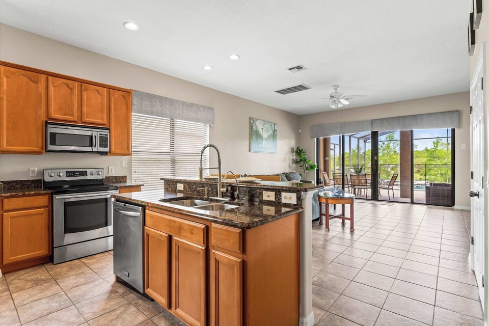 The open, airy kitchen offers ample space & every home comfort