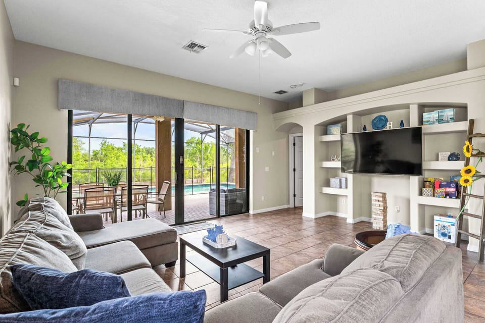 Spacious living area with plush seating, and Smart TV