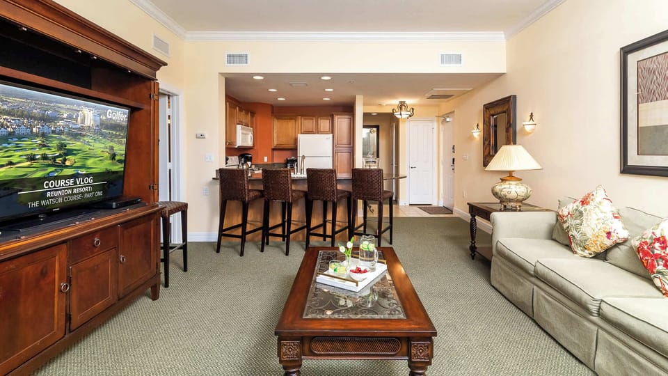 Open concept living room and kitchen area with bar stool seating