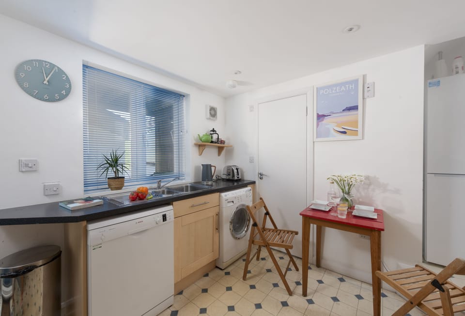 The Studio at Rockside, Polzeath. Ground floor: Including an electric oven and hob, fridge, microwave, Nespresso Vertuo Coffee Machine, and washing machine