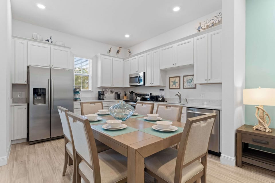 The beachy eat-in kitchen offers ample space & all the comforts of home