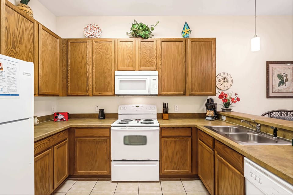 The kitchen offers sprawling counterspace, homey amenities, and ample storage