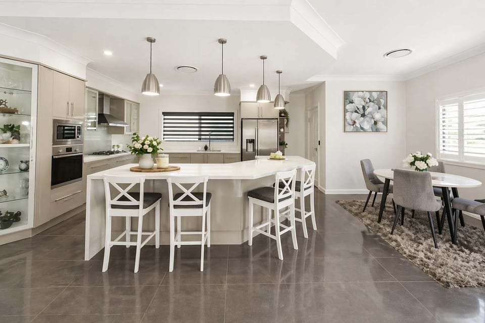 Kitchen and dining area with island bench and seating