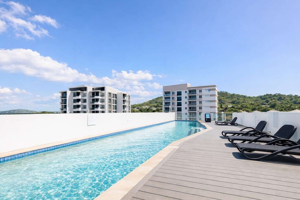 Resort-style pool with sun loungers – ideal for cooling off after a day at the Stadium or Strand