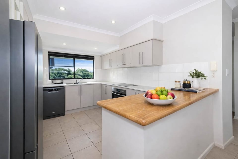 Contemporary Kitchen with Timber Breakfast Bar