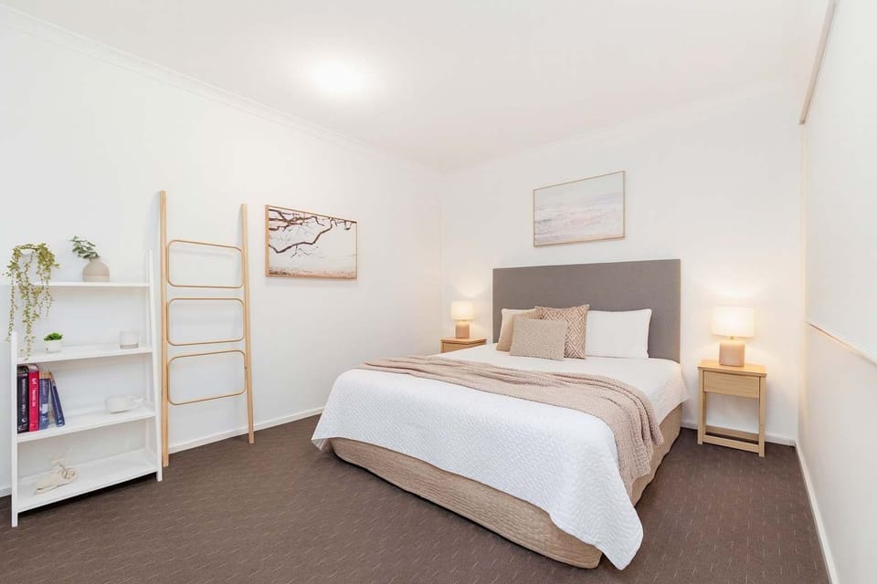 Light-Filled Master Bedroom with Premium Bedding