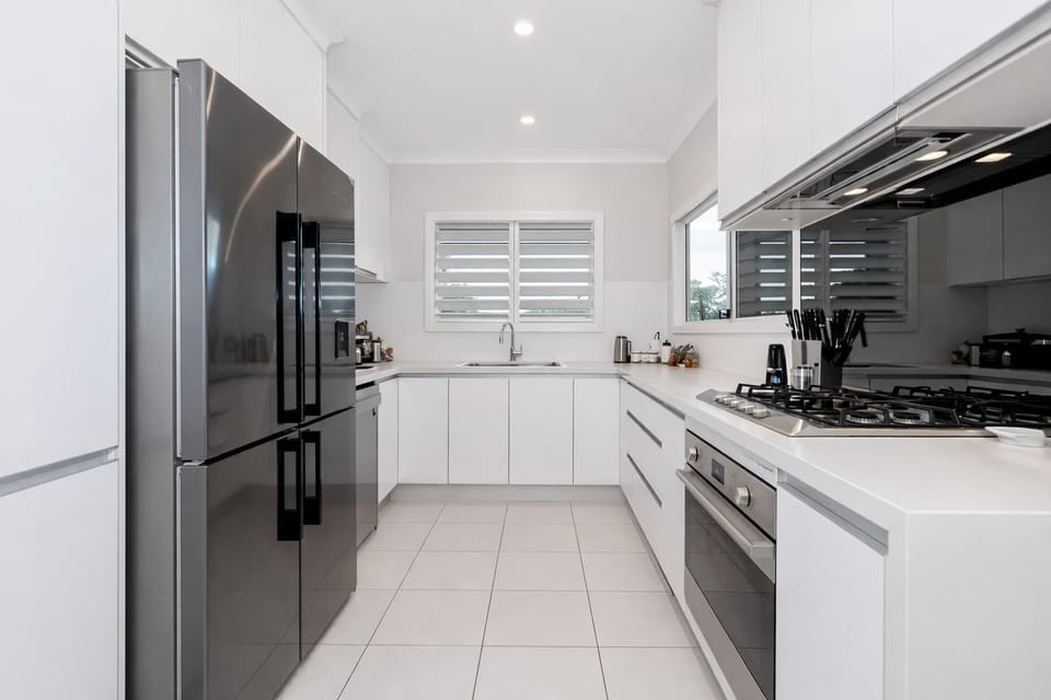 Bright kitchen with ample bench space and full cooking facilities