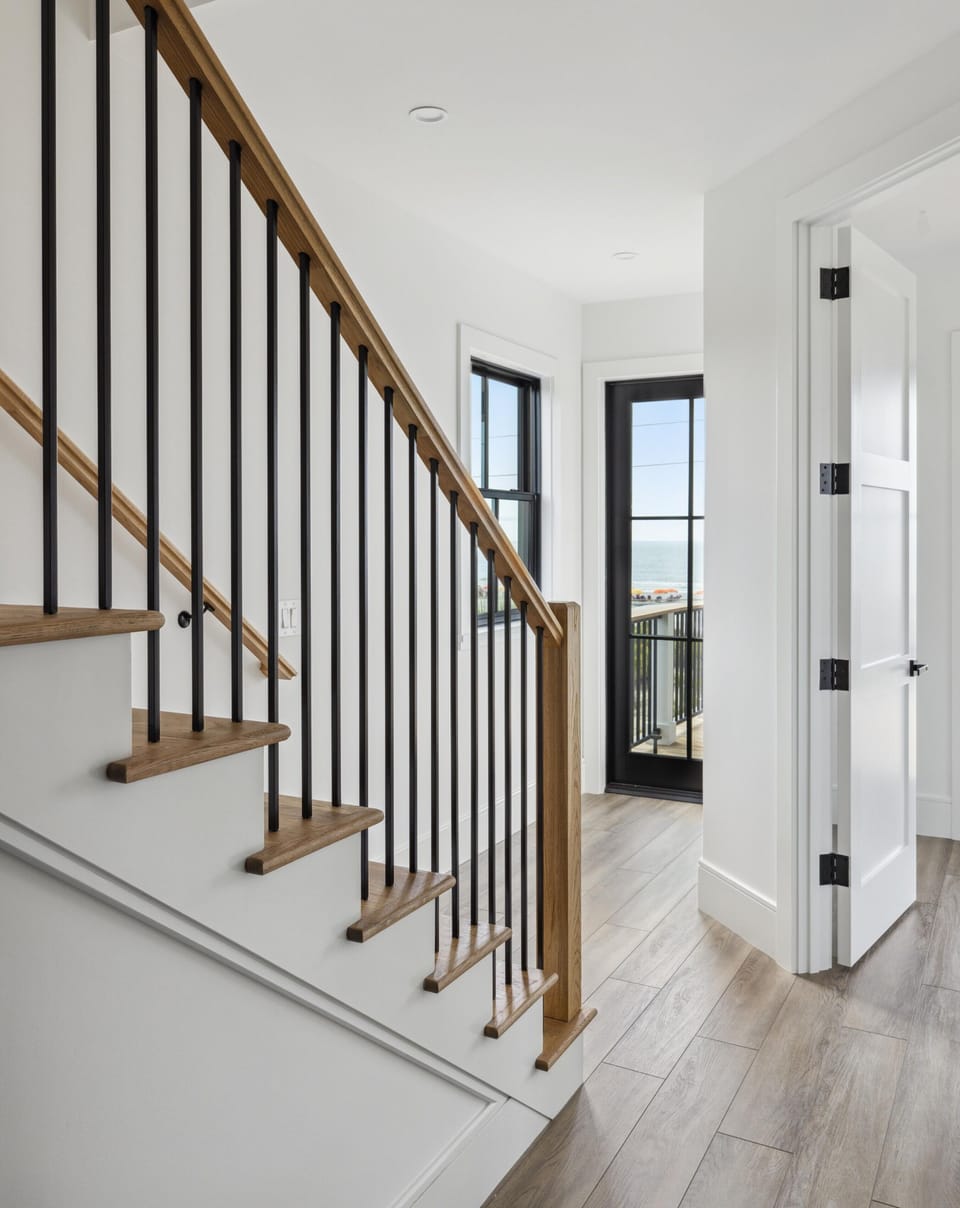 Upstairs hallway leading to second floor patio with additional outdoor dining space