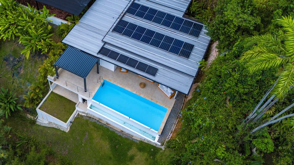 Refresh in your private pool with views of lush rainforest canopy