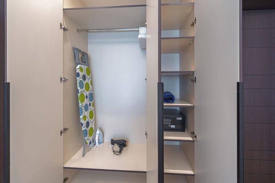 Iron board, Iron, Hair dryer, and safe.