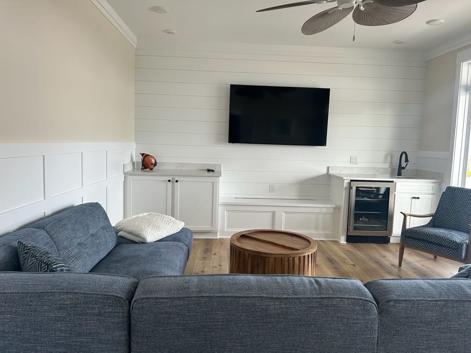 Second floor family room with wet bar, mini fridge and professional game table