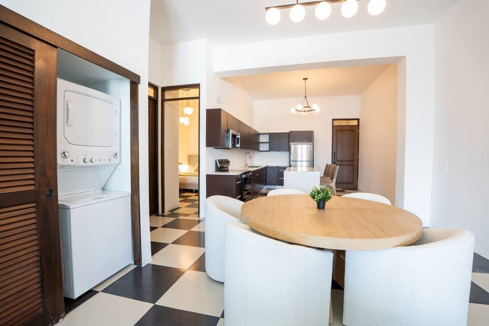 Open-concept living and dining with in-unit laundry.