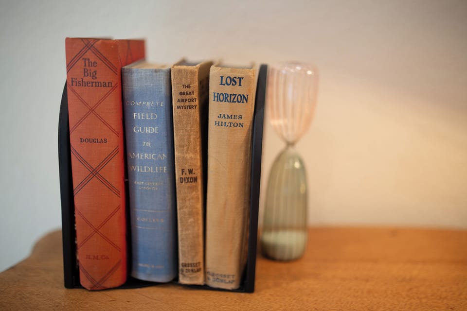 A charming selection of vintage books for a relaxing evening.