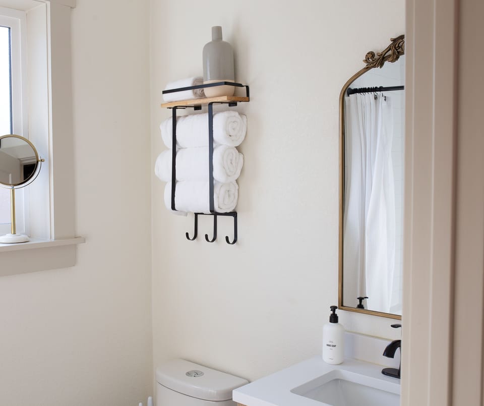  Neatly stacked towels in a bright, modern bathroom.
