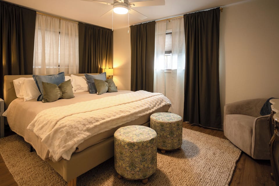 Serene bedroom with lush textiles.