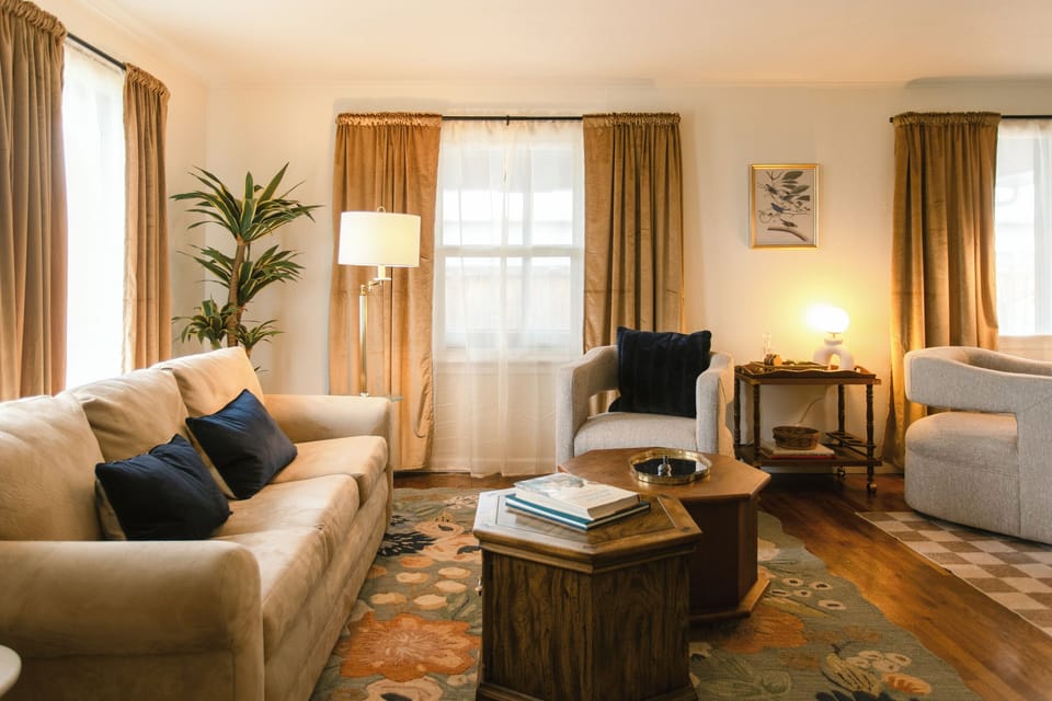 Full view of the living room with cozy seating and warm decor.