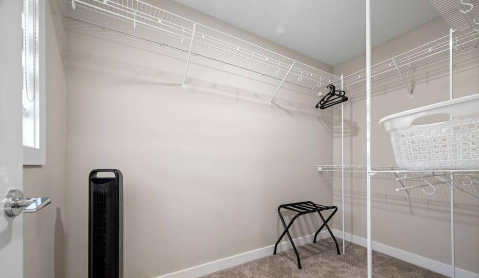 Fan in each bedroom for cooling. Closet shelving, luggage rack, and laundry basket for your convenience.