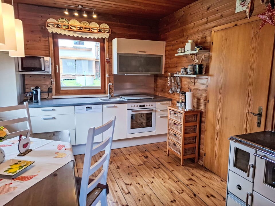 Kitchen, Wood, Major Appliance, Kitchen Appliance, Furniture, Countertop, Flooring, Interior Design, Cabinetry, Kitchen Stove