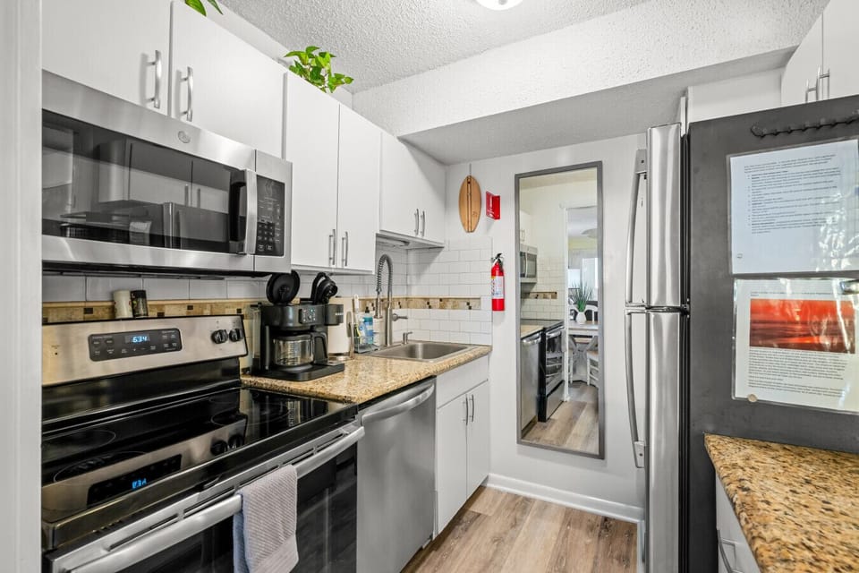 Fully stocked kitchen with stainless steel appliances and everything you need to cook, brew coffee, and feel right at home.