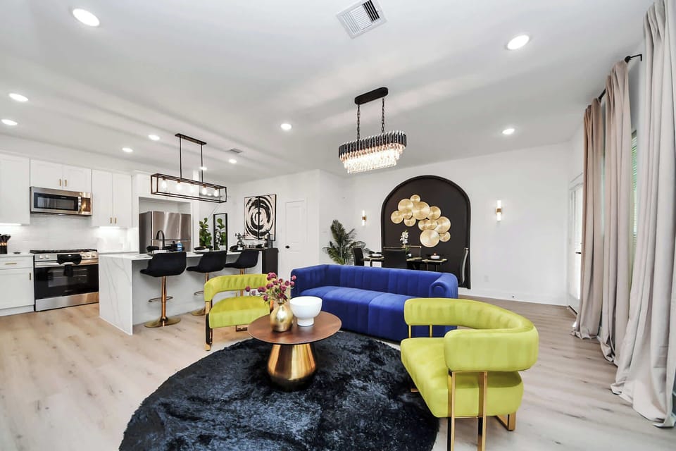 Chic lounging meets gourmet convenience — unwind in the living room while staying connected to the kitchen and dining.