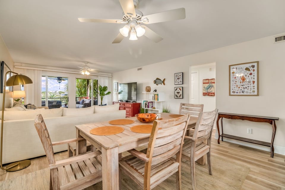 Spacious dining area seats 6-8 guests - perfect for family meals in Perdido Key rental