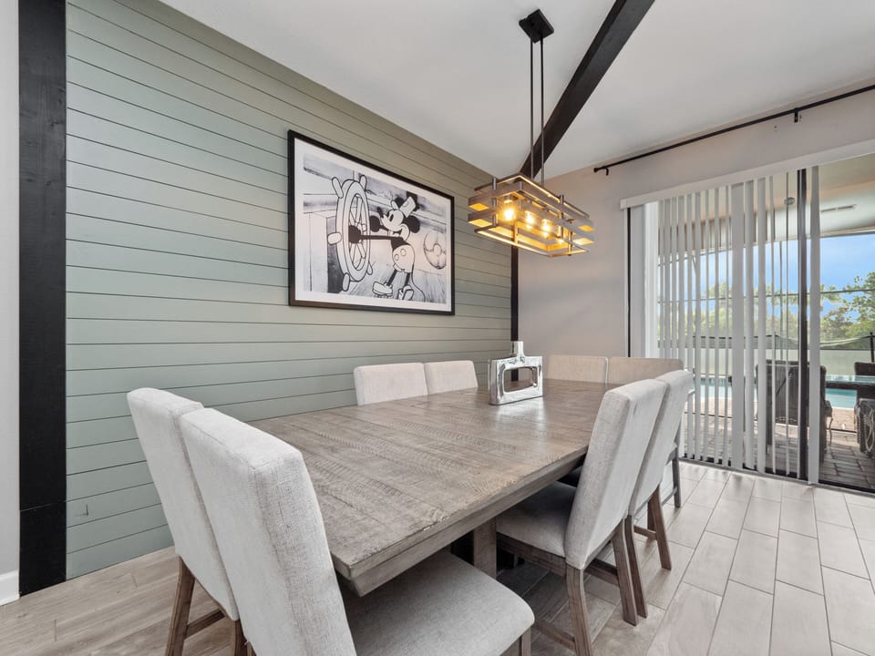 Luxurious Downstairs Area with Dining Table Flat Screen TV and Comfortable Lounge