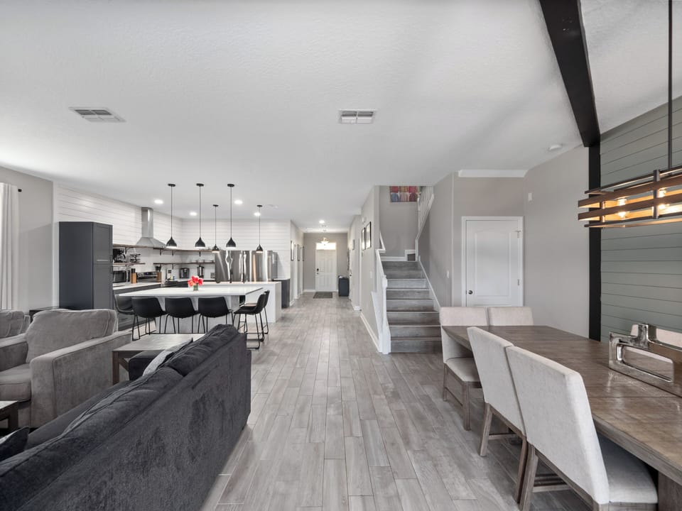 Luxurious Downstairs Area with Dining Table Flat Screen TV and Comfortable Lounge