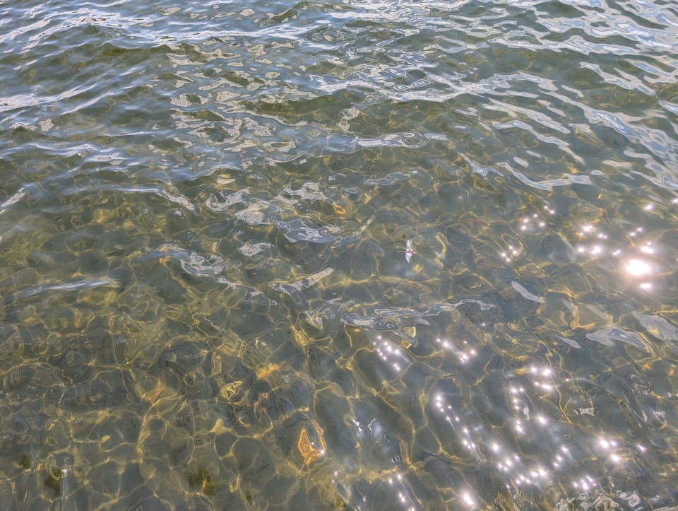Clear water, sandy bottom lake - across the road