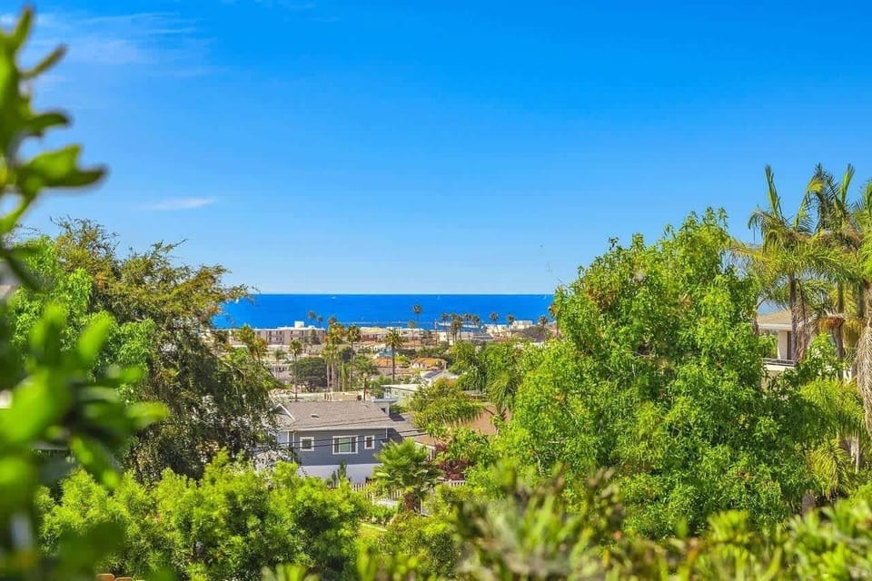Ocean views from multiple balconies and window of this beautifully remodeled property. It's an oasis near the beach!