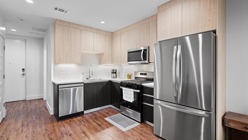Fully equipped kitchen with silver appliances
