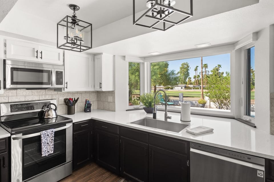 The large kitchen window has the most amazing view out back of the pool and out onto the golf course