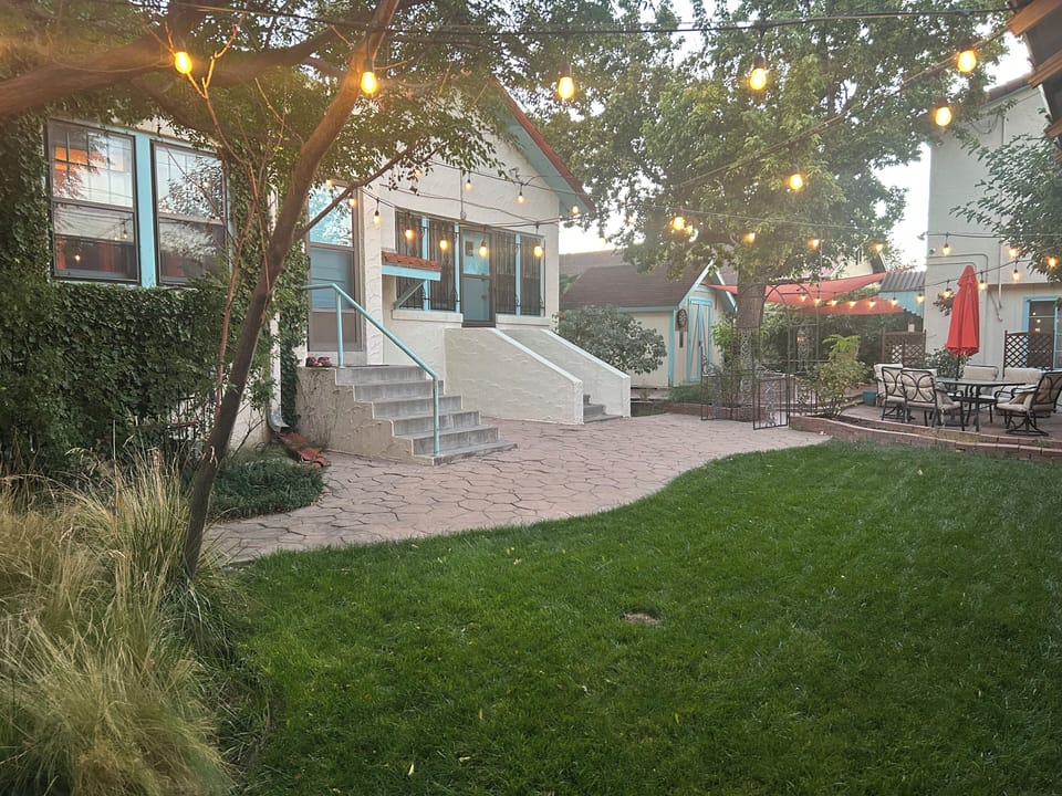Your suite is at the top of the steps with the white stucco balustrade.