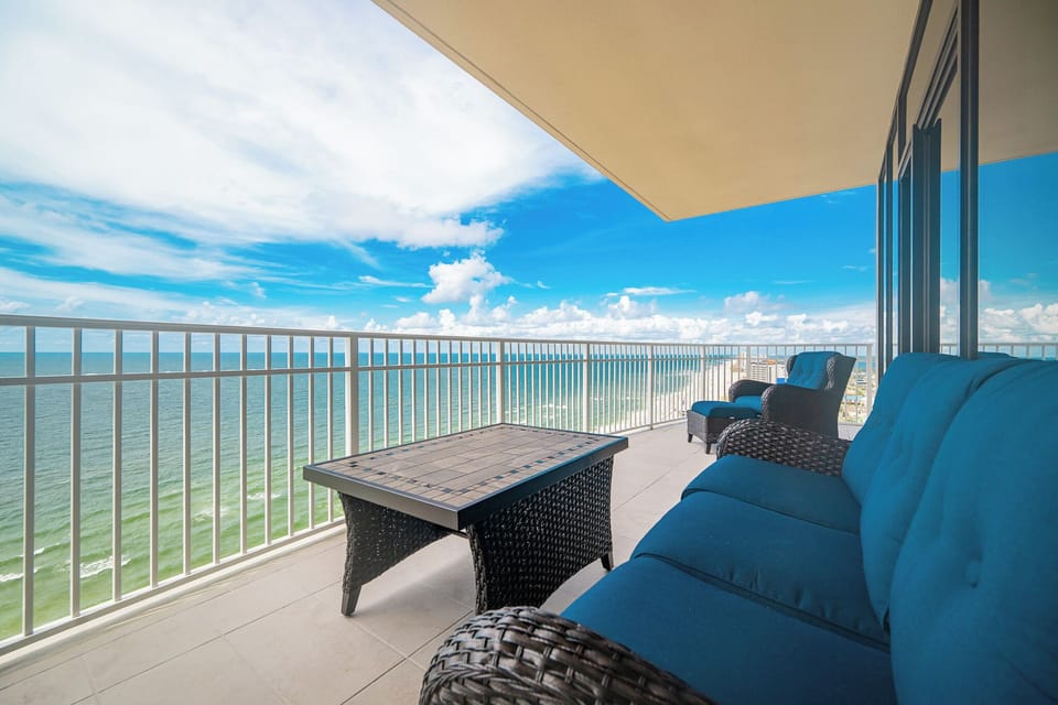 Relax on your balcony while enjoying stunning coastal views of the shimmering gulf waters and vibrant skies