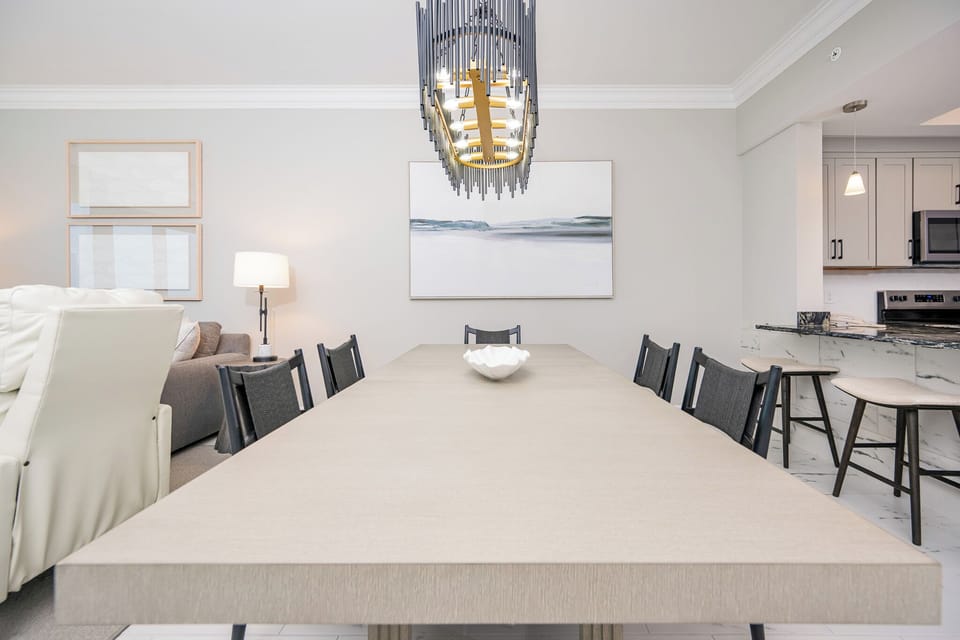 Dine comfortably at the spacious table, surrounded by elegant decor and inviting lighting for memorable gatherings