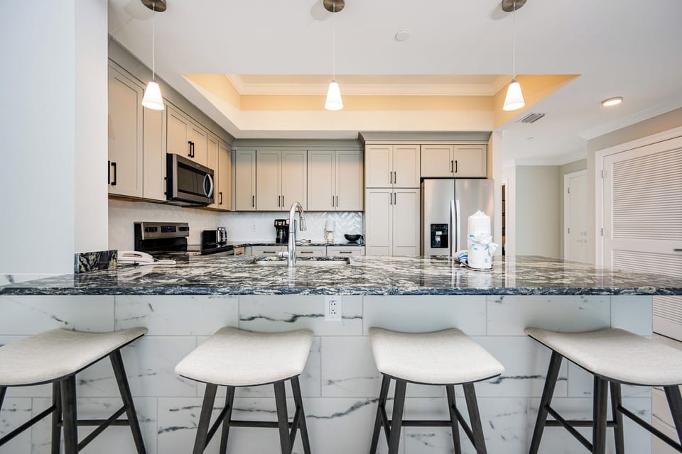 Gather around this stylish kitchen, perfect for casual meals and enjoying time with loved ones