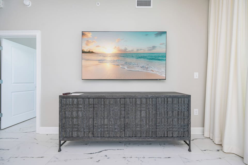 Stream your favorite shows or relax with some music after a fun day at the beach in this relaxing living space