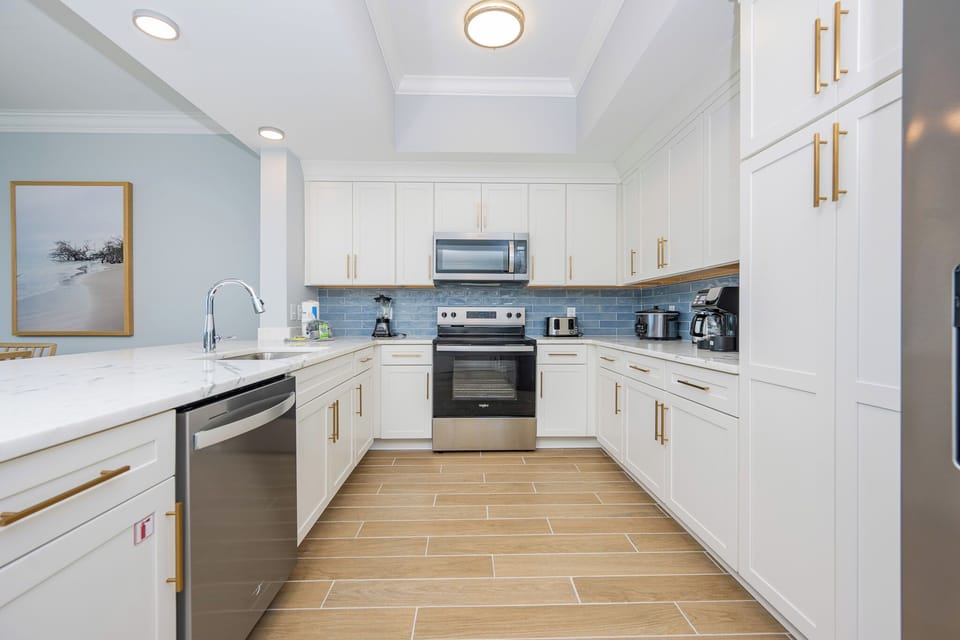 Prepare delicious meals in this stylish kitchen featuring stainless appliances and a welcoming vibe